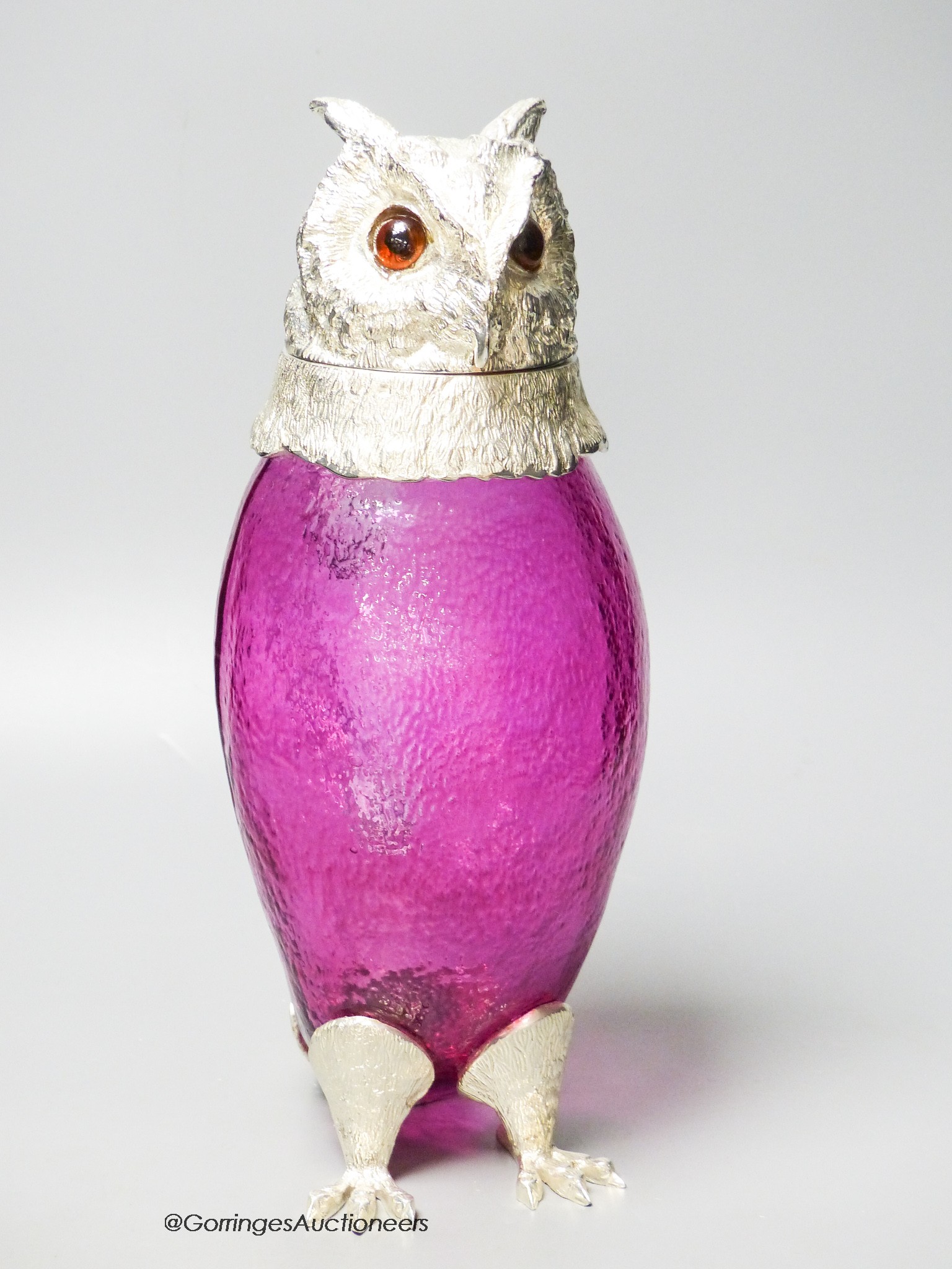 A cranberry glass and electroplate 'owl' claret jug, height 29cm